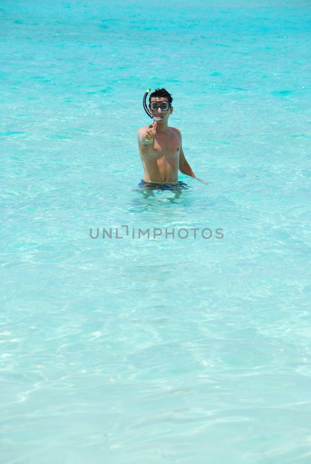 man excited with thumbs up for snorkeling adventure in Maldives