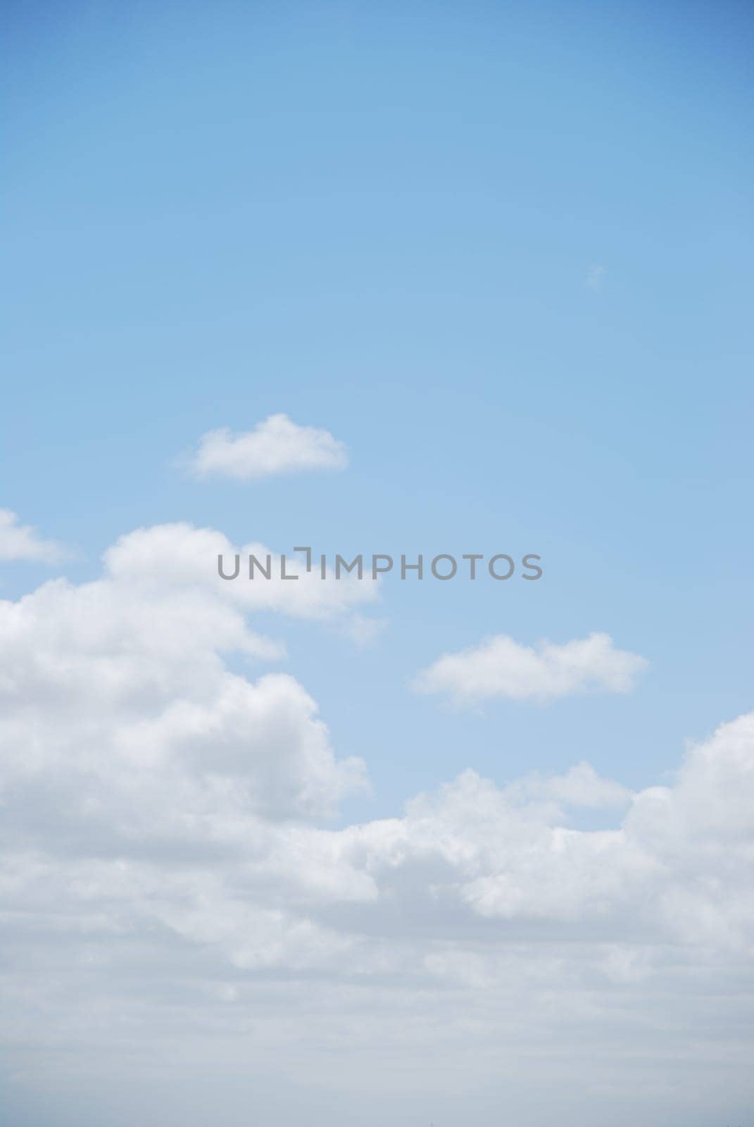 photo of enchanted clouds on light blue sky