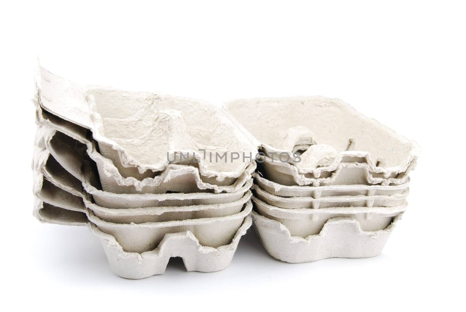 pile of empty egg boxes isolated on white background