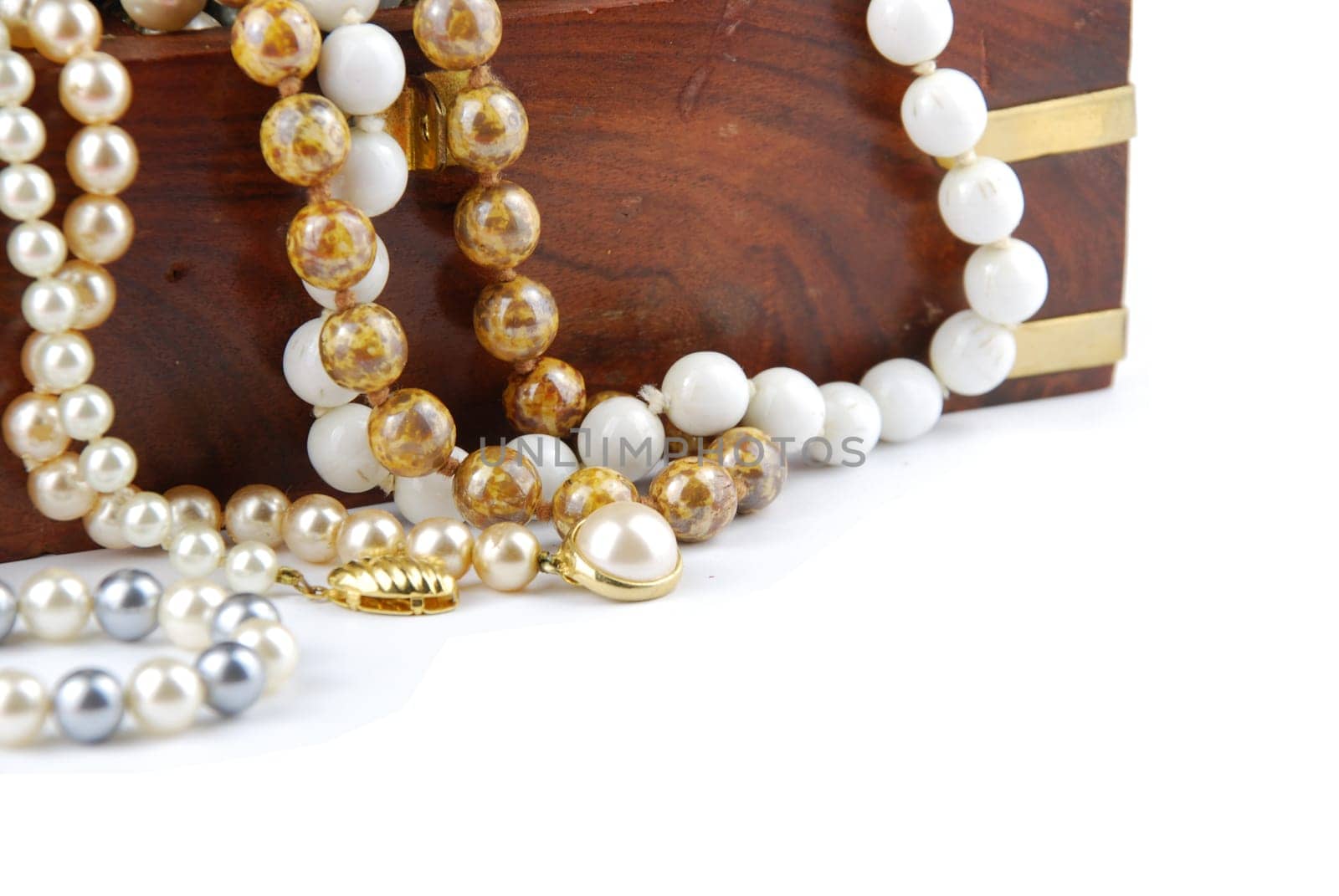 jewel box with pearl necklaces isolated on white background