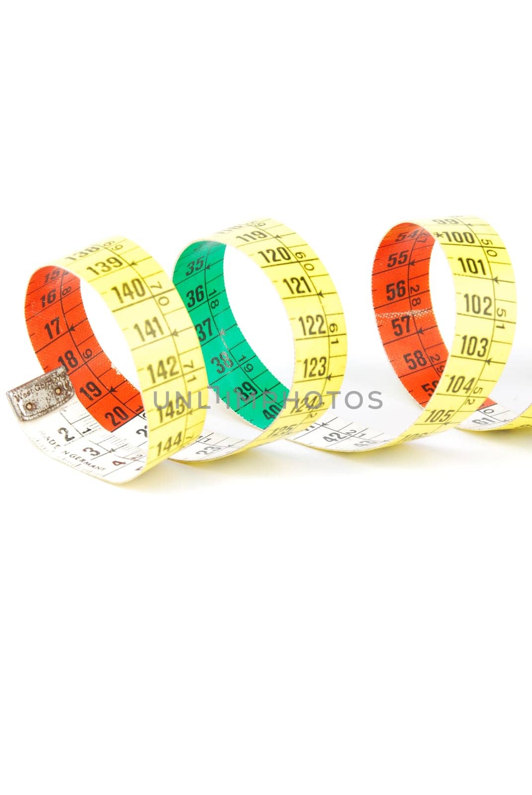 curled measuring tape isolated on white background