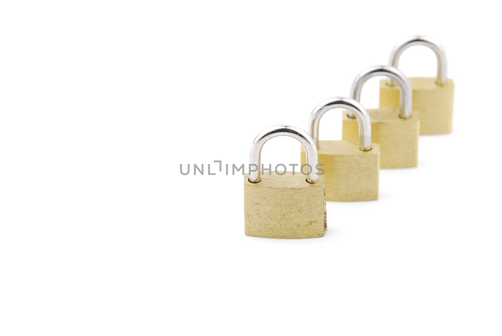 golden closed padlocks isolated on white background (focus on the first)