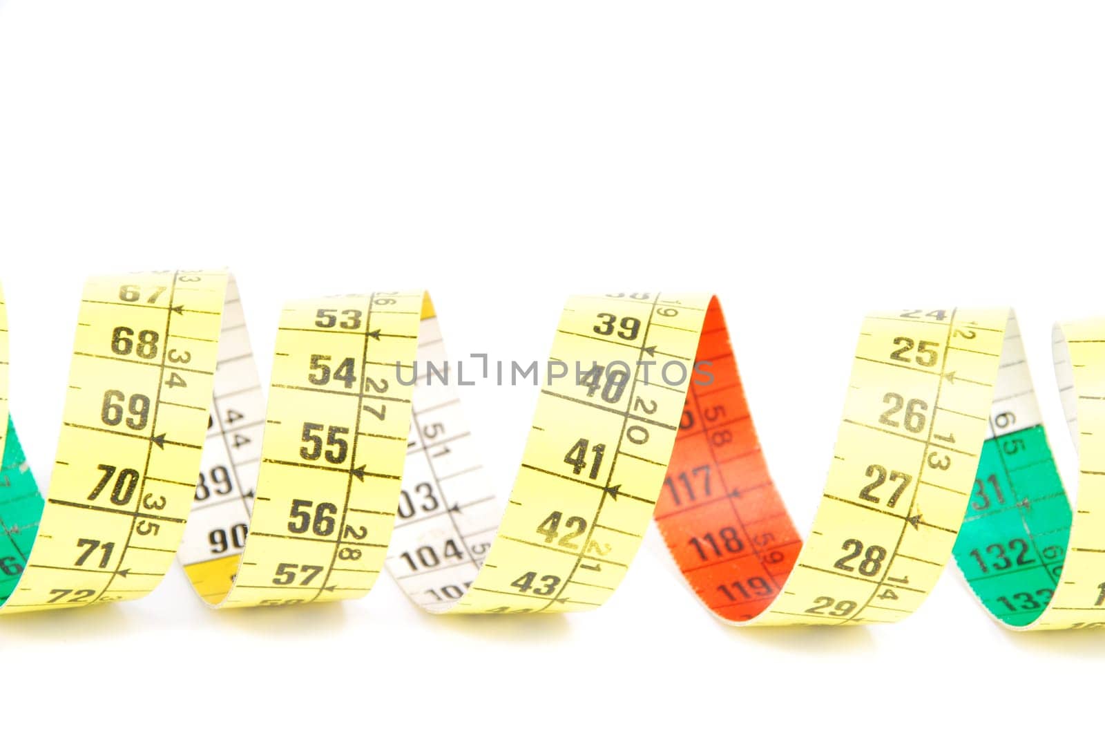 curled measuring tape isolated on white background