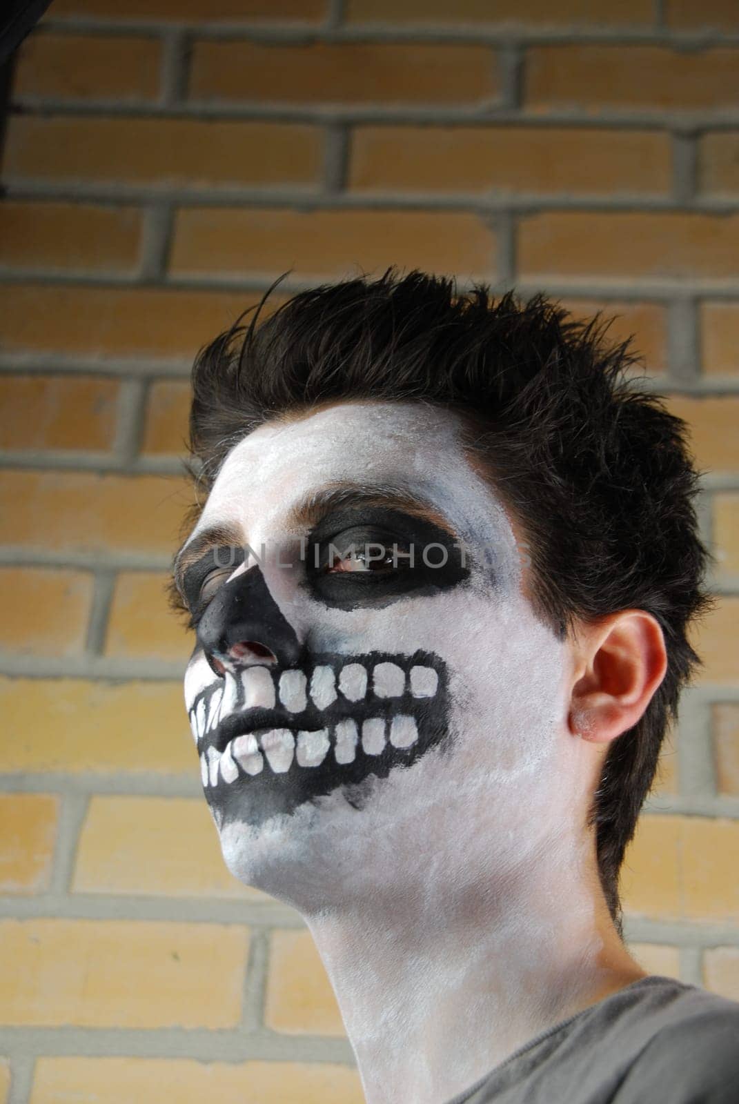 portrait of a creepy skeleton guy perfect for Carnival (brick wall background)