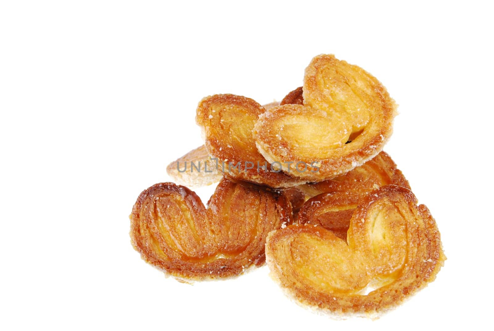 bunch of fresh palmier cookies isolated on white background