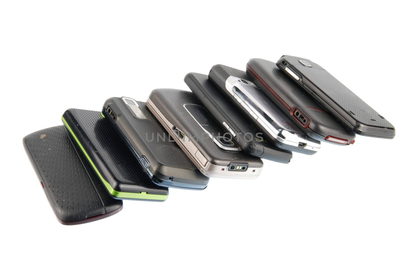 row of several mobile phones isolated on white background