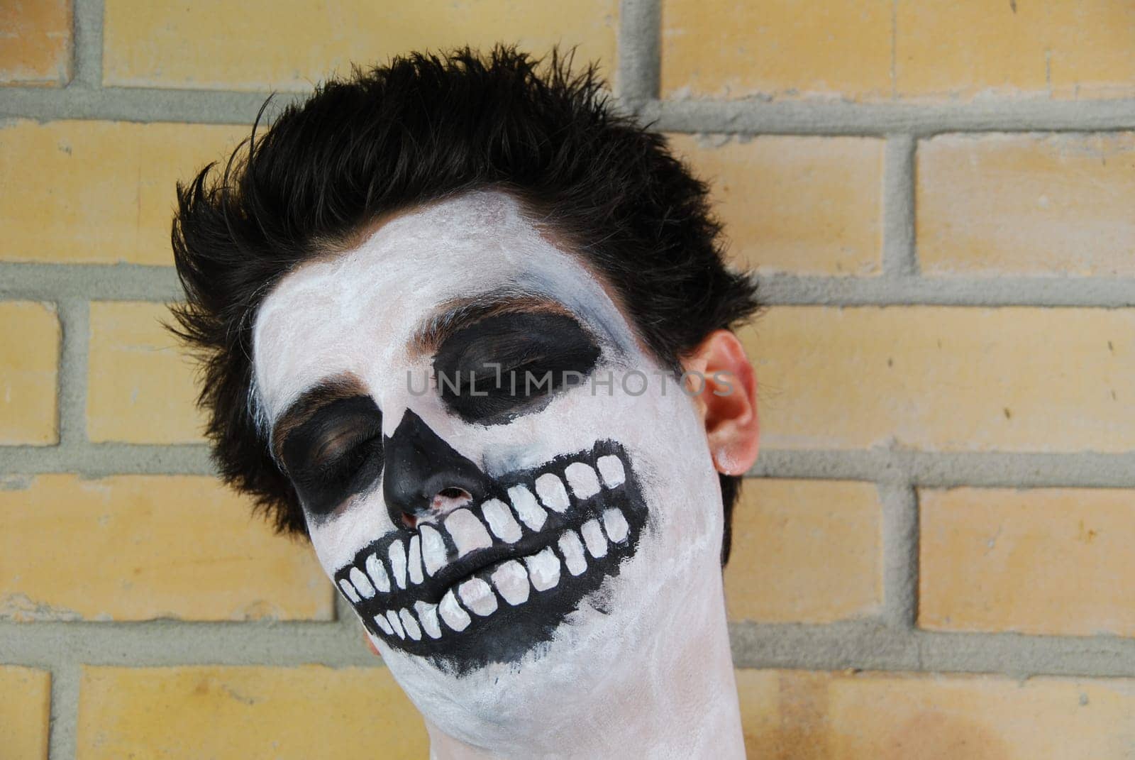 Don&#039 t wake him up, portrait of a creepy skeleton guy perfect for Carnival (brick wall background)