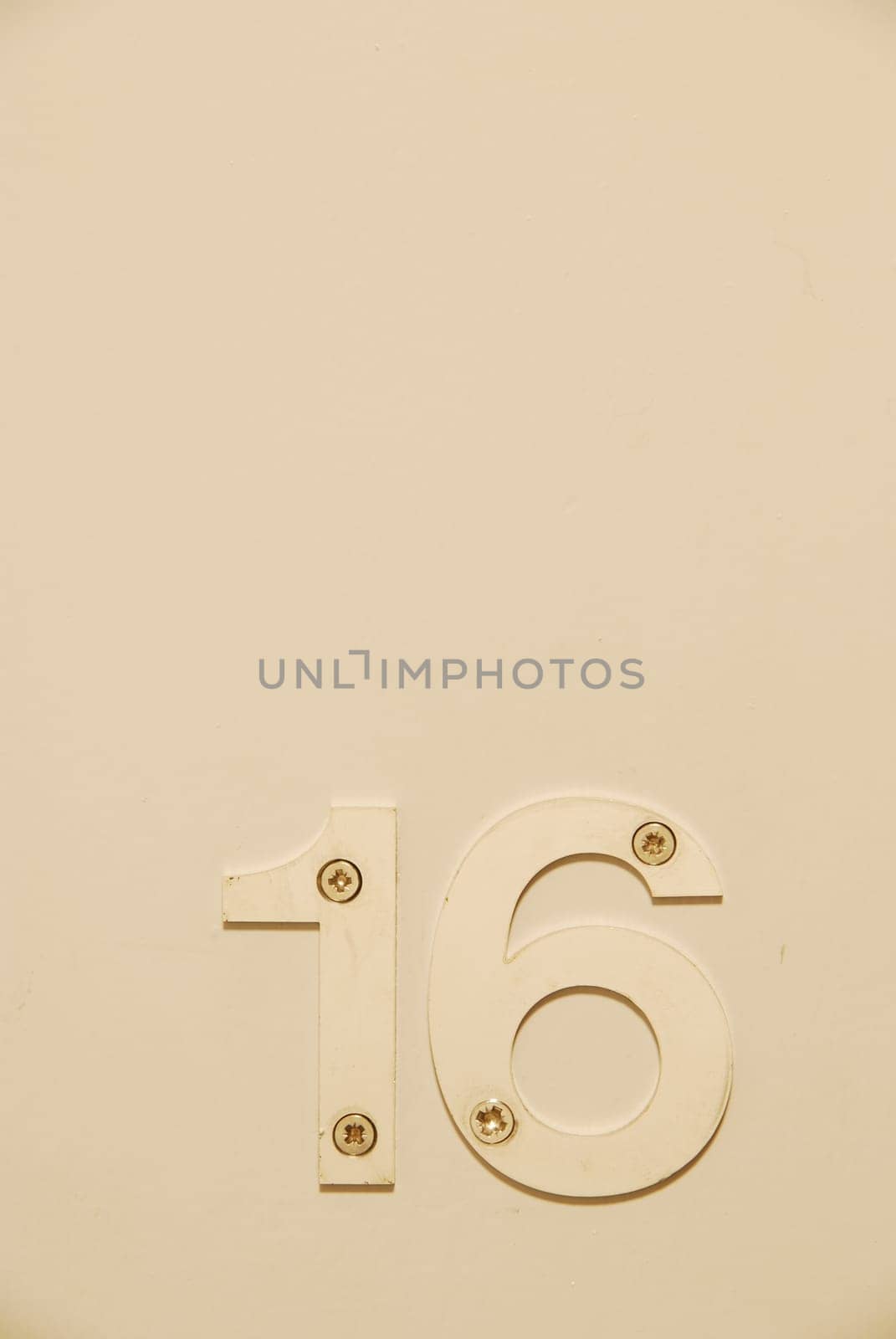 white flat number hanging on the door