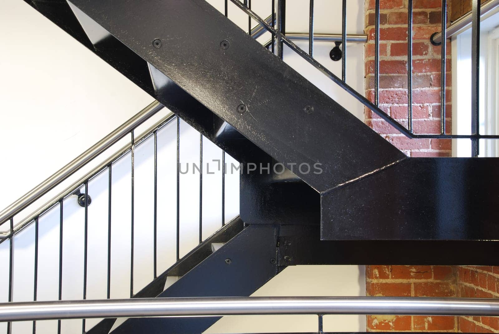 vintage staircase on a antique residential building with brick wall stones as a strong architectural detail