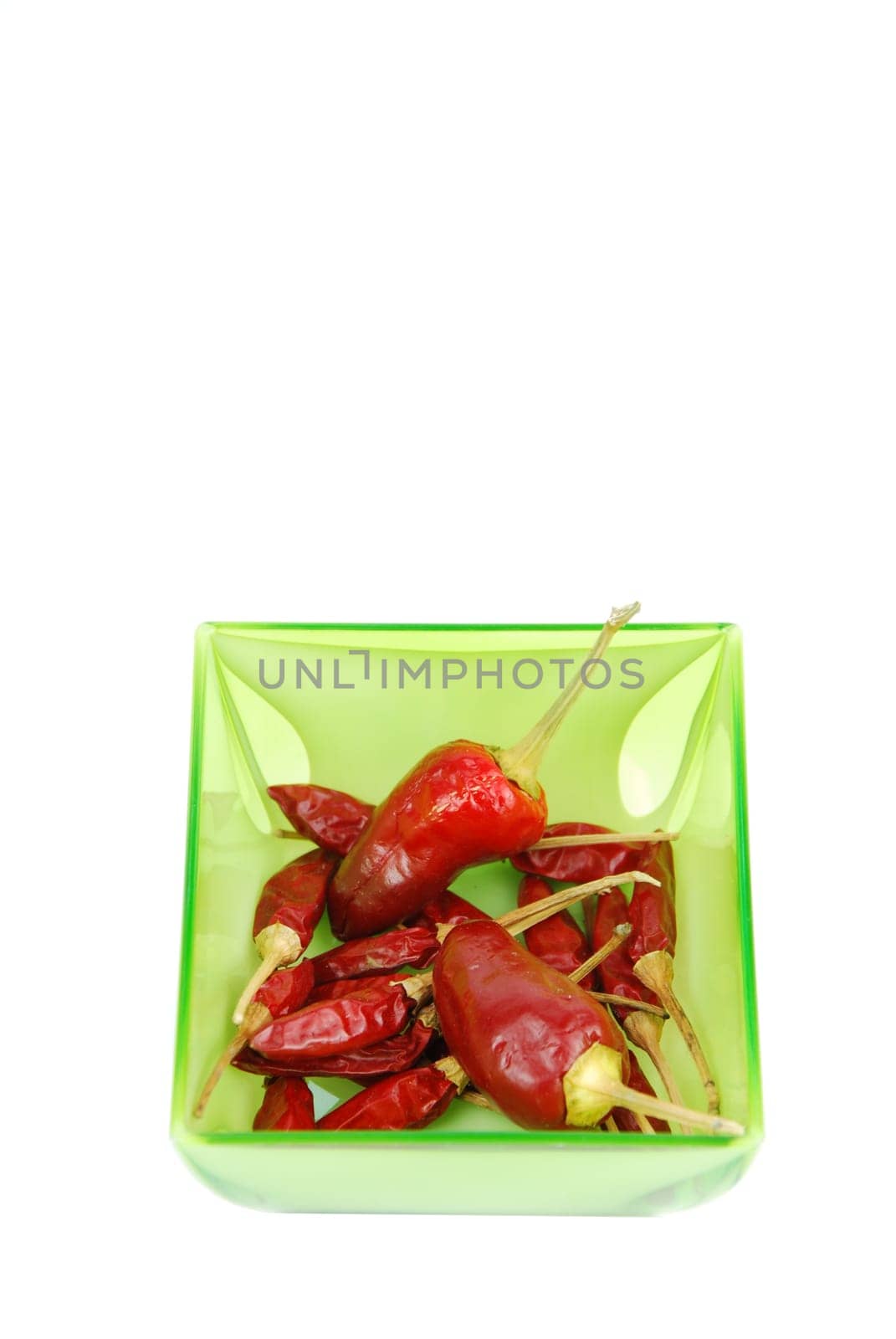red chili peppers on a cup isolated on white background