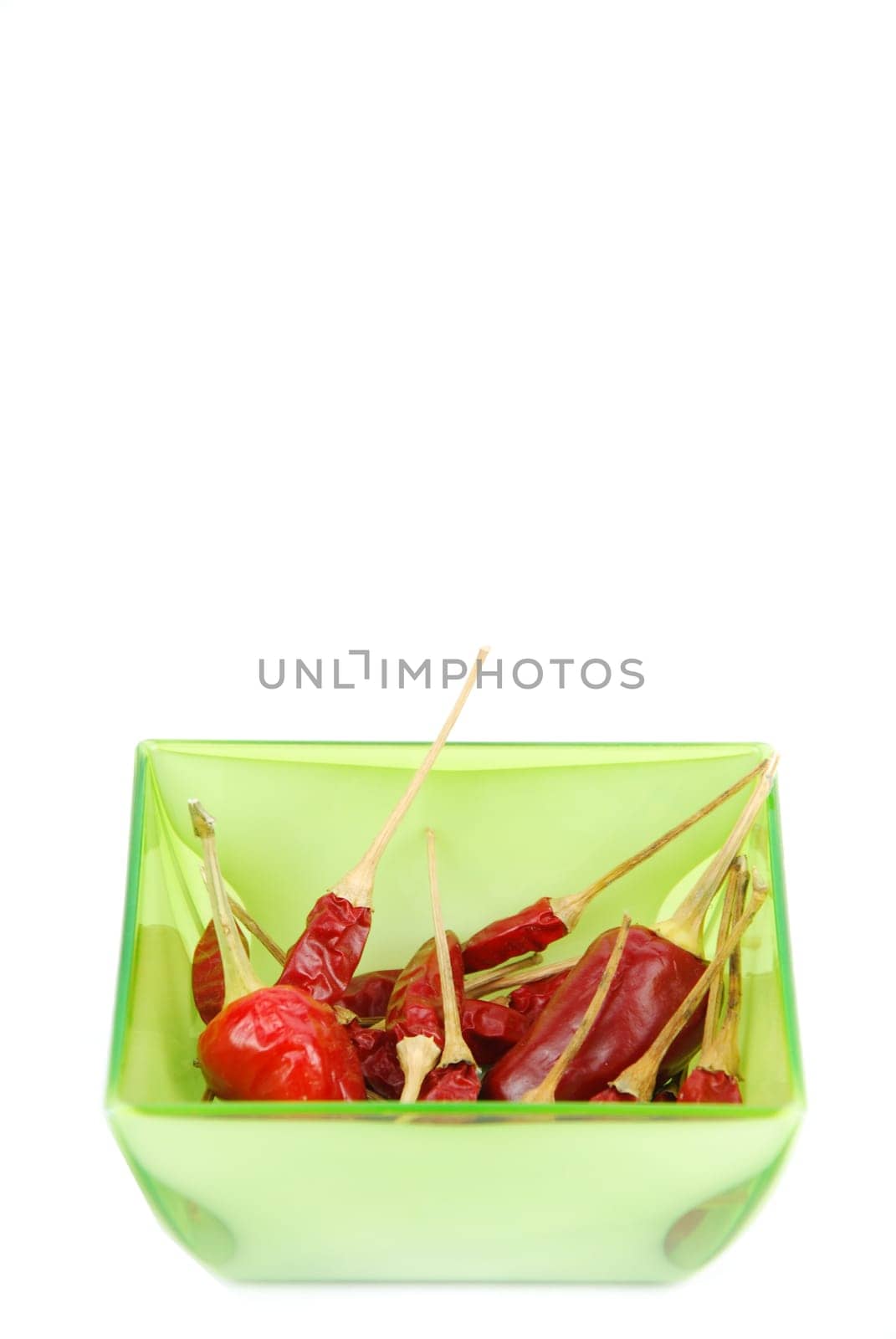 red chili peppers on a cup isolated on white background