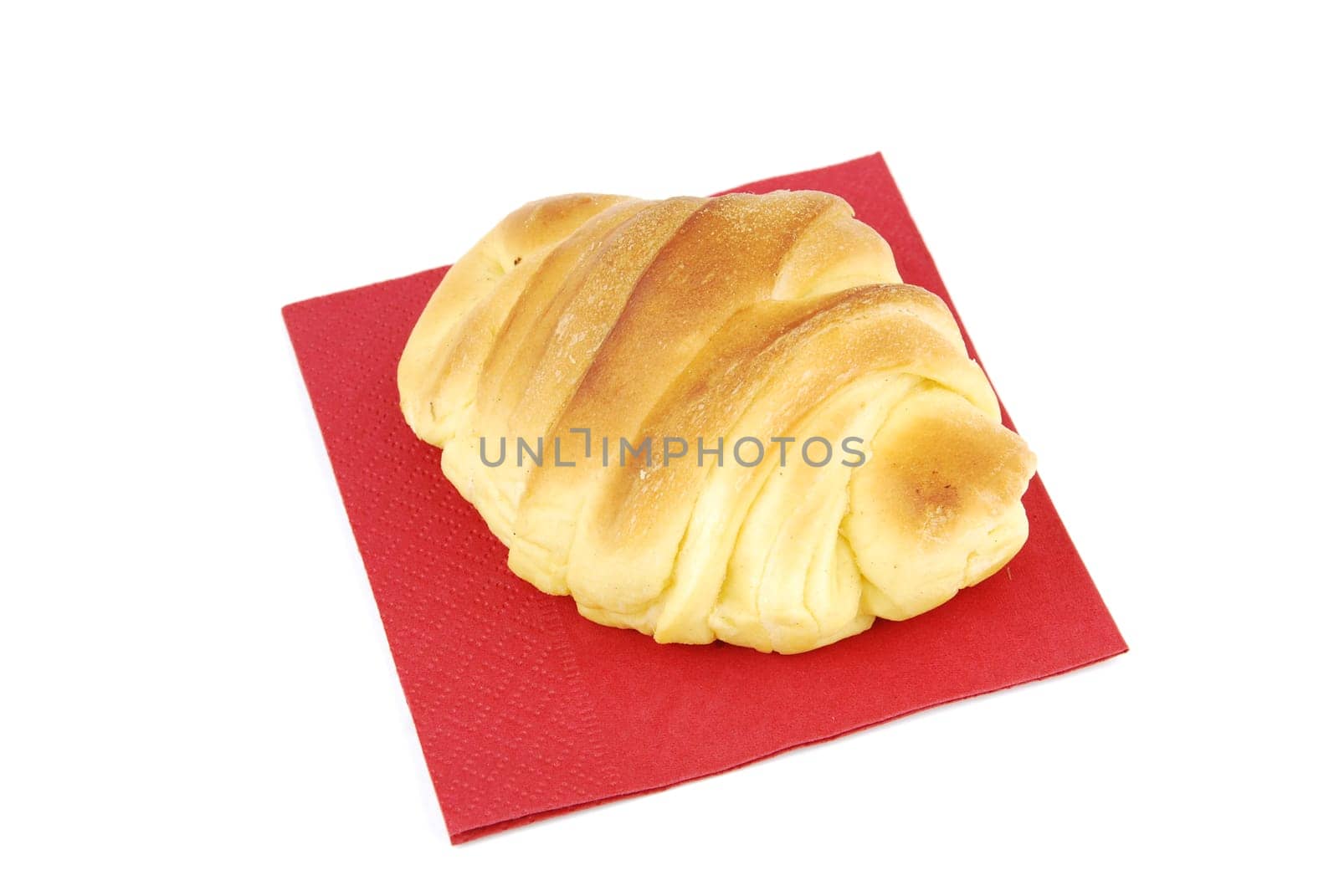 fresh croissant with red napkin isolated on white background