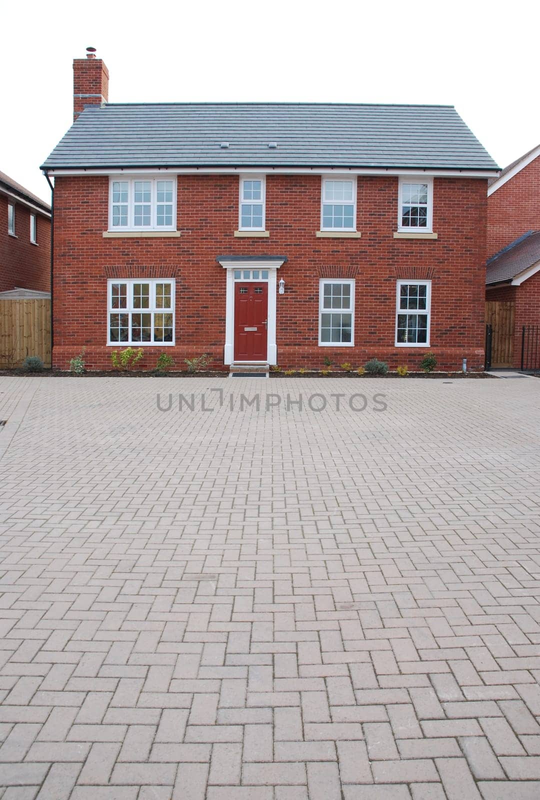 detached and typical british residential house with small entrance garden (isolated on white)