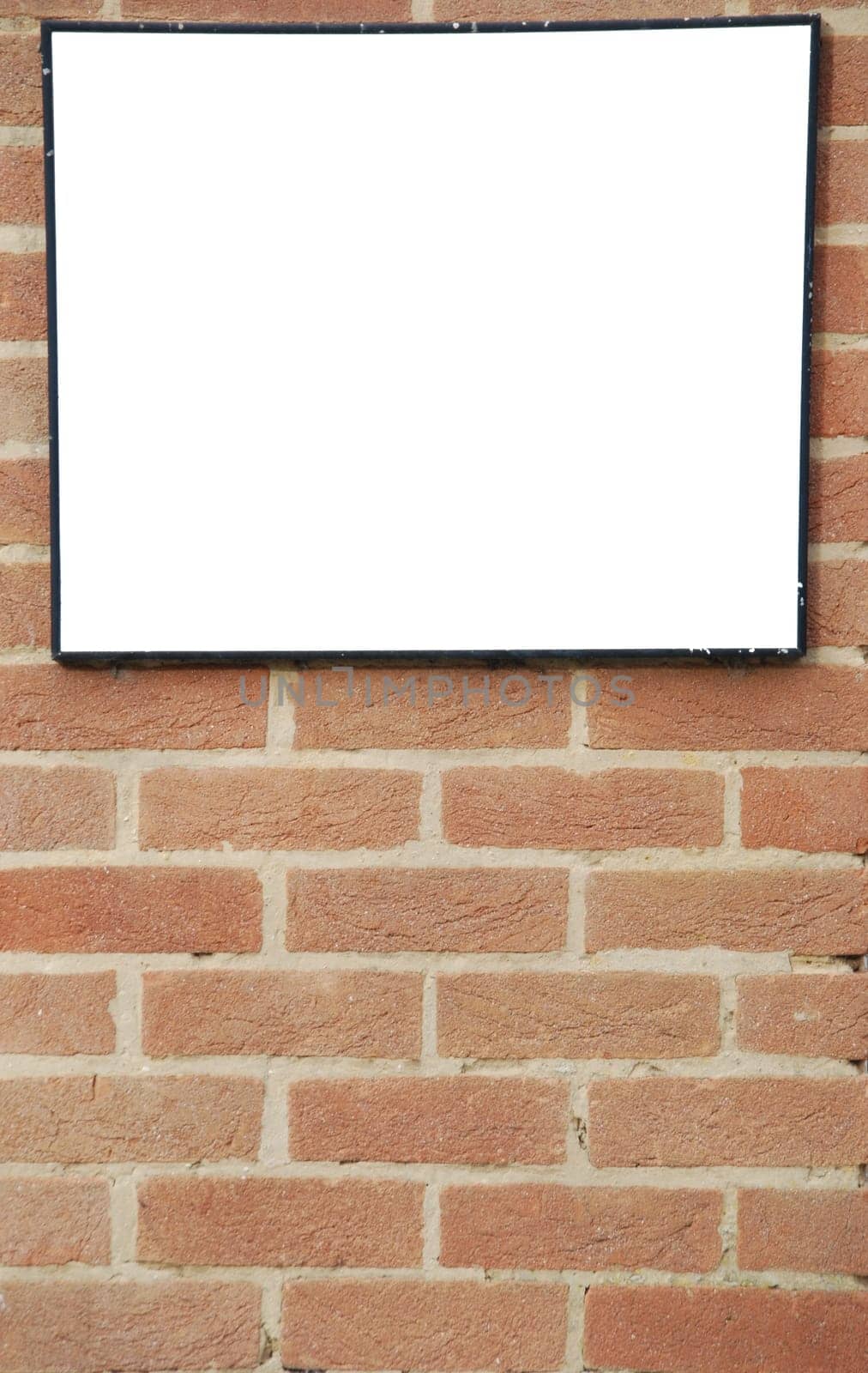 empty billboard on a beautiful brick wall building