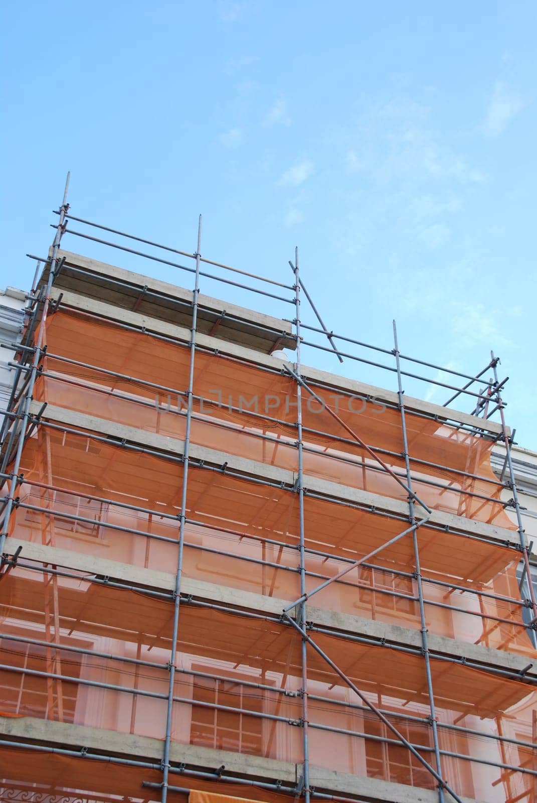 residential building under construction (blue sky background)