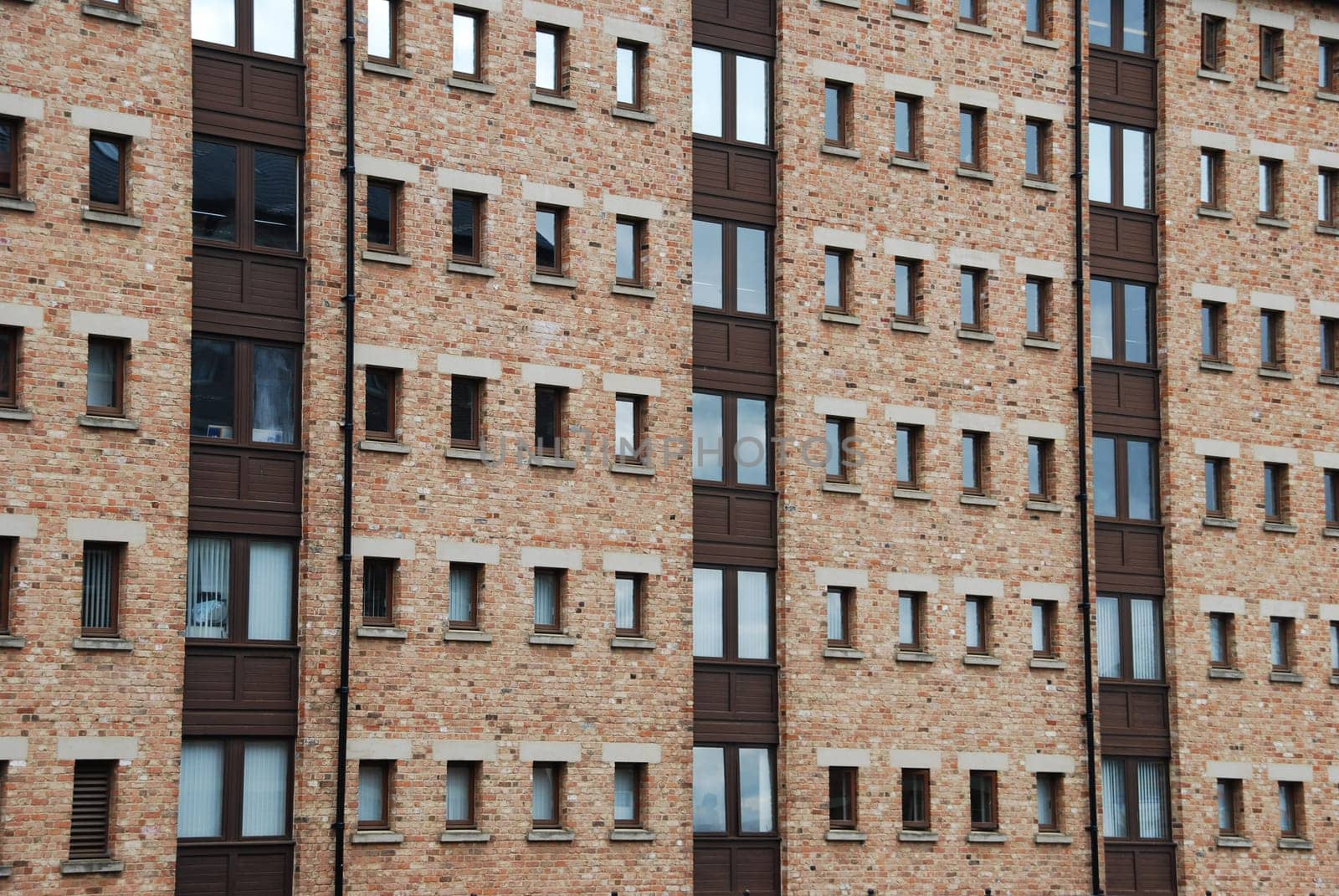 antique brick wall building with windows (british architecure)