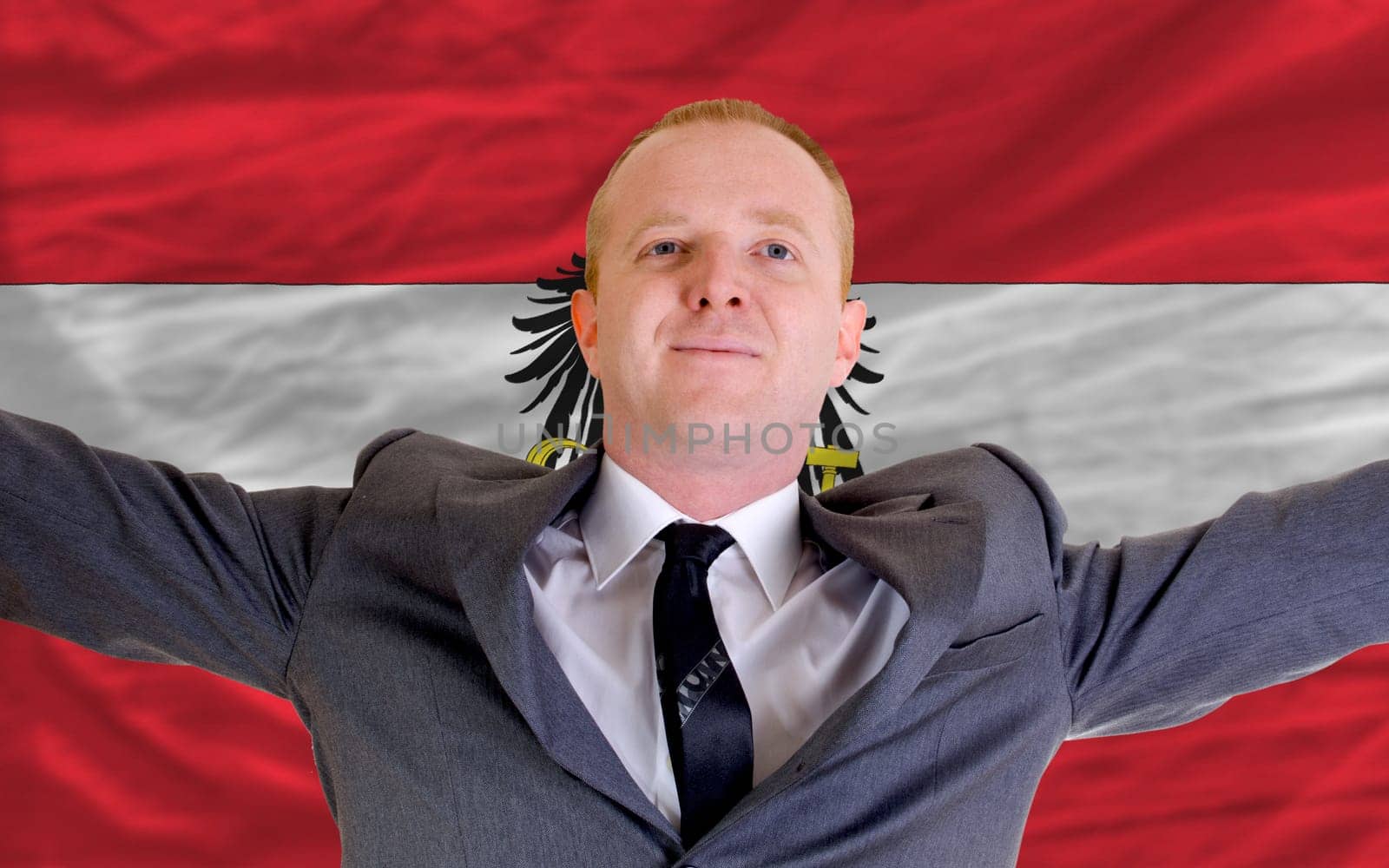 joyful investor spreading arms after good business investment in austria