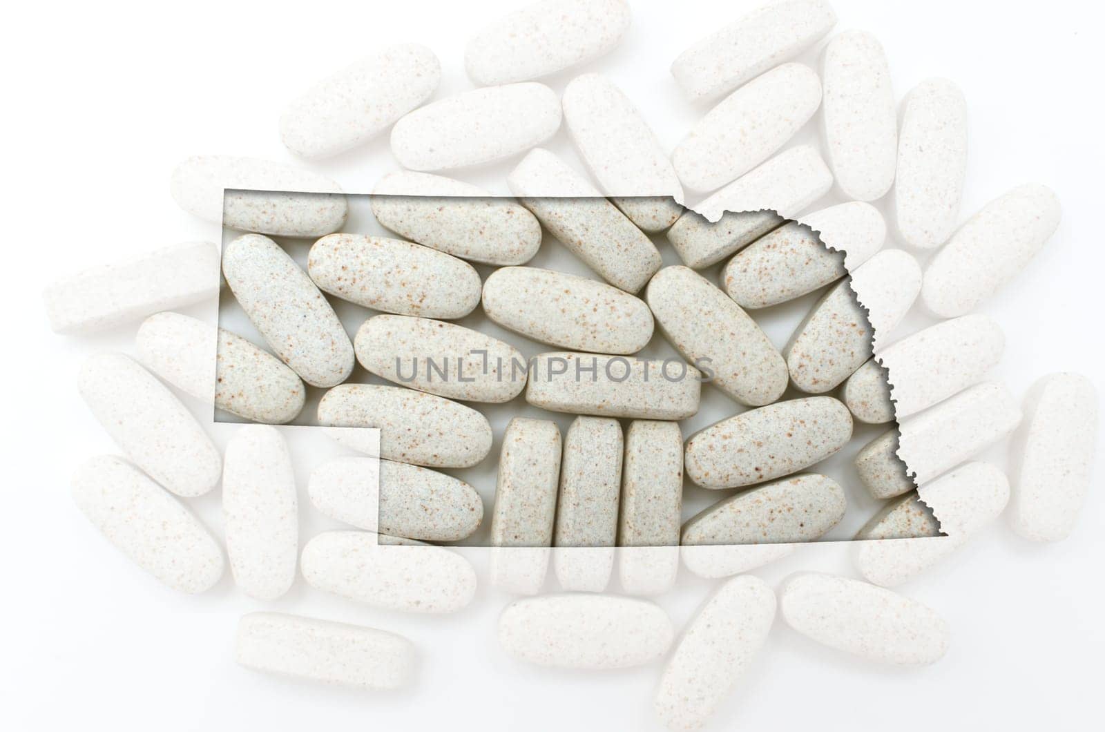 Outlined nebraska with transparent background of capsules
