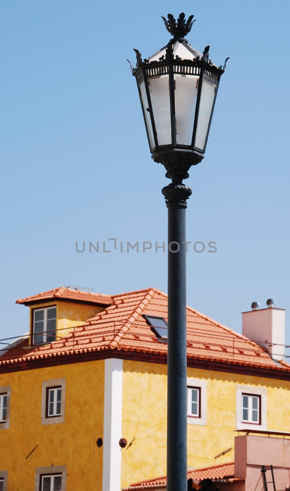 beautiful and traditional view of antique buildings and lamp post in Lisbon, Portugal