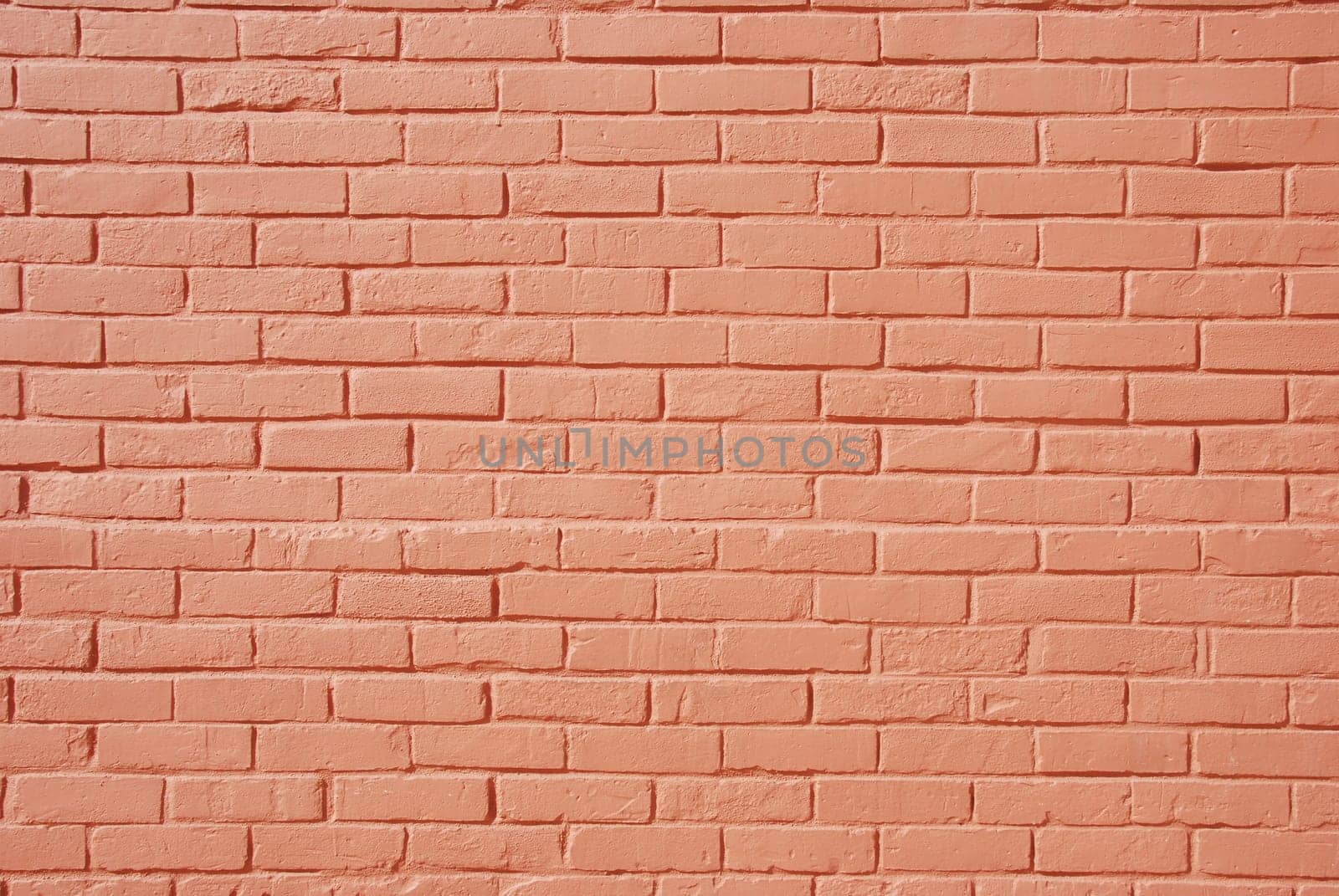 background or texture of a salmon/pink brick wall