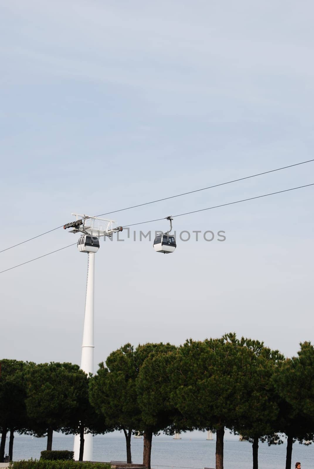 two modern cablecars in Nations Park in Lisbon, Portugal