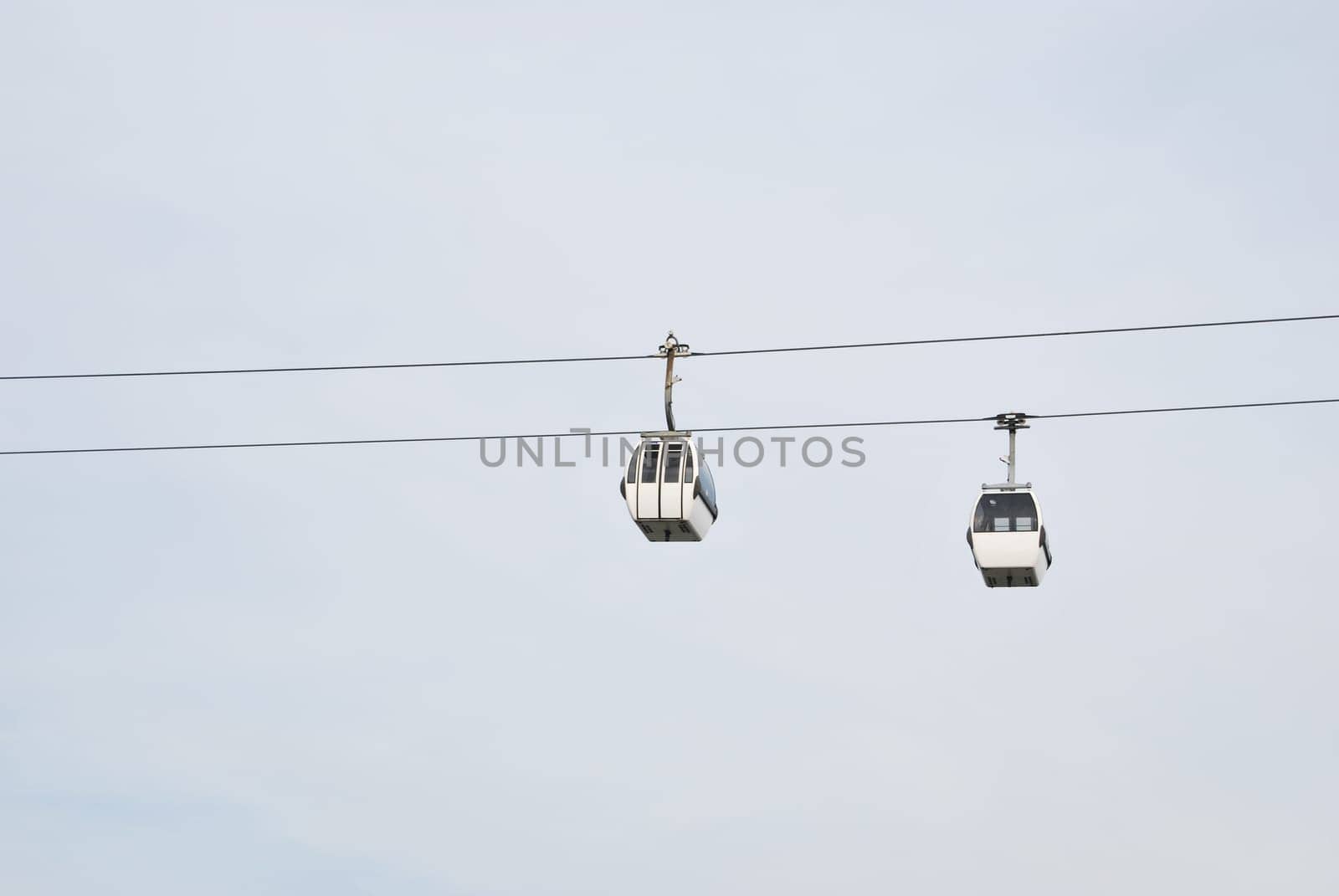 two modern cablecars in Nations Park in Lisbon, Portugal