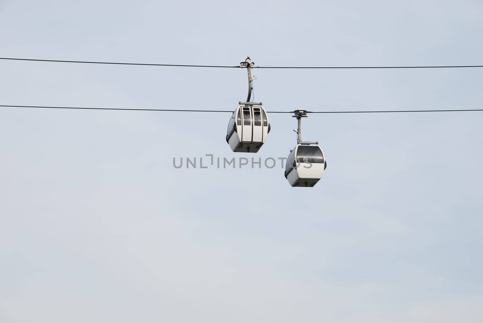 two modern cablecars in Nations Park in Lisbon, Portugal
