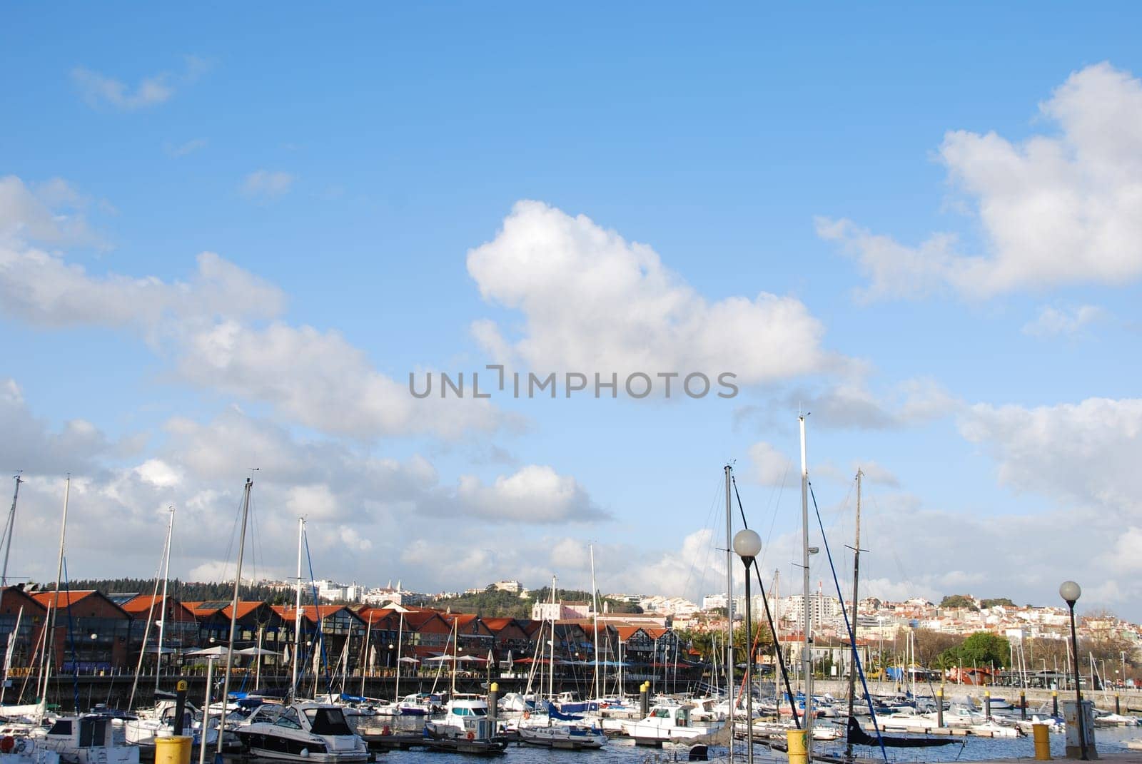 beautiful docks in Lisbon, on the background the typical houses used as restaurants/pubs
