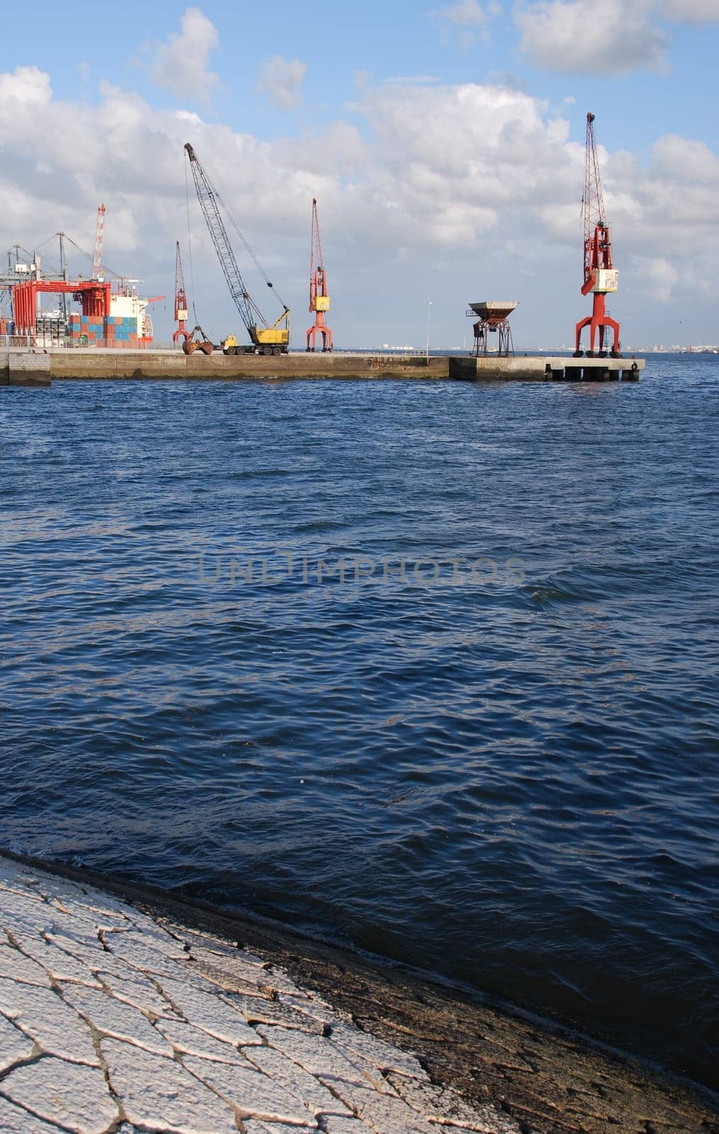 beautiful view to Lisbon&#039 s shipyard along the Tagus river (Portugal)