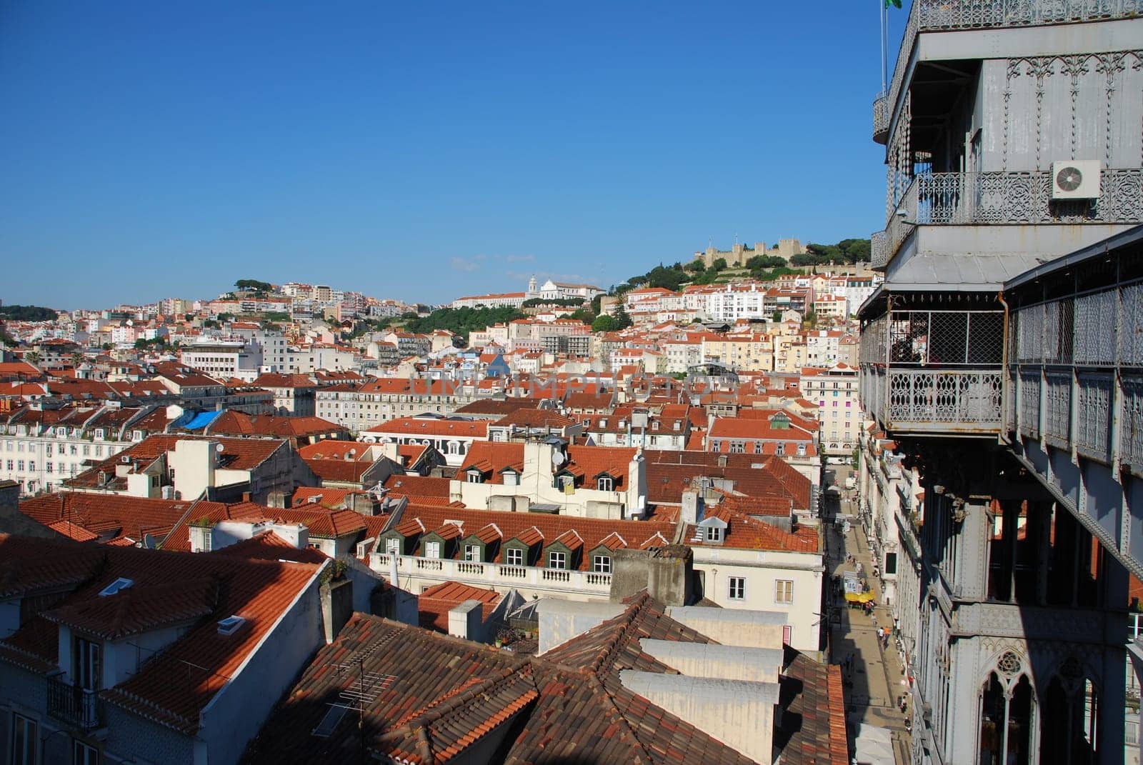 beautiful cityscape of Lisbon with Graça Church, Sao Jorge Castle and Santa Justa Elevator, Portugal (from left to right)