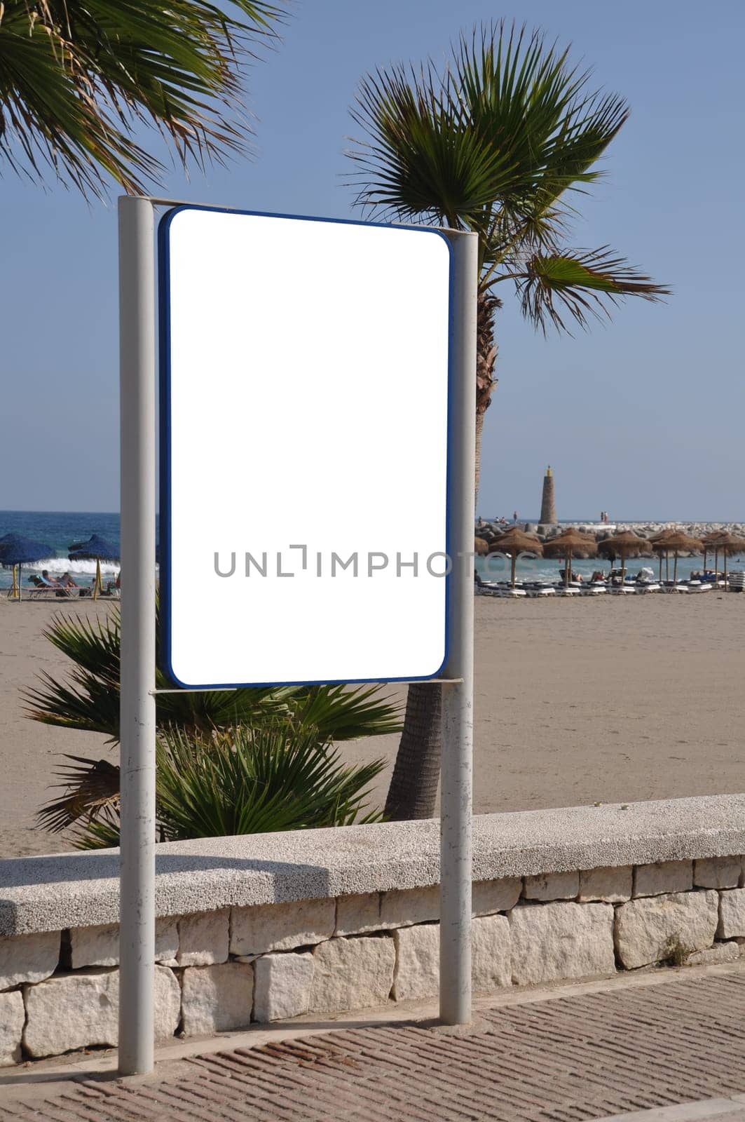 empty billboard and sidewalk at the beach