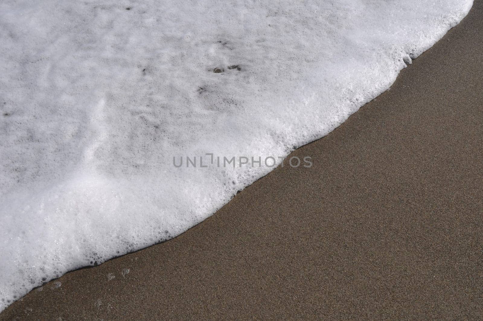 gorgeous beach sand and sea foam (copy-space available)
