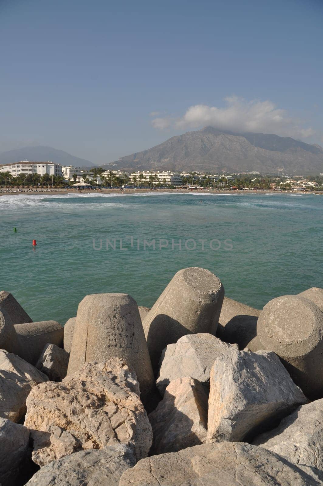 Puerto Banus beach from stone pier in Marbella, Spain
