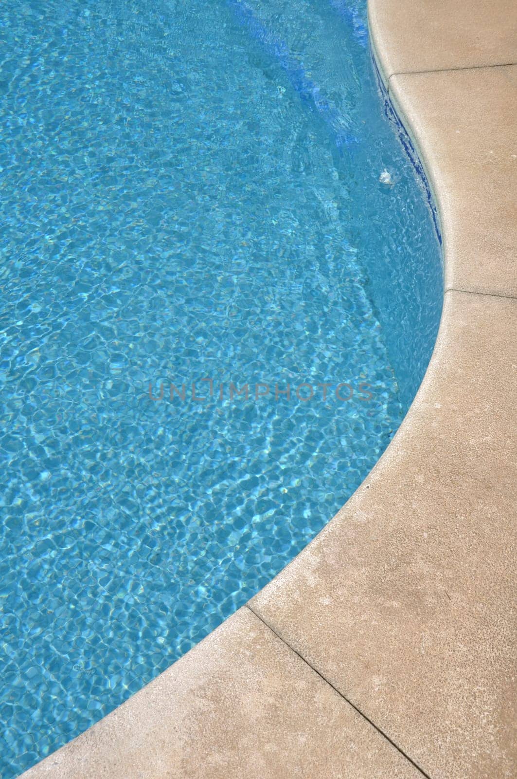 blue and vibrant swimming pool side