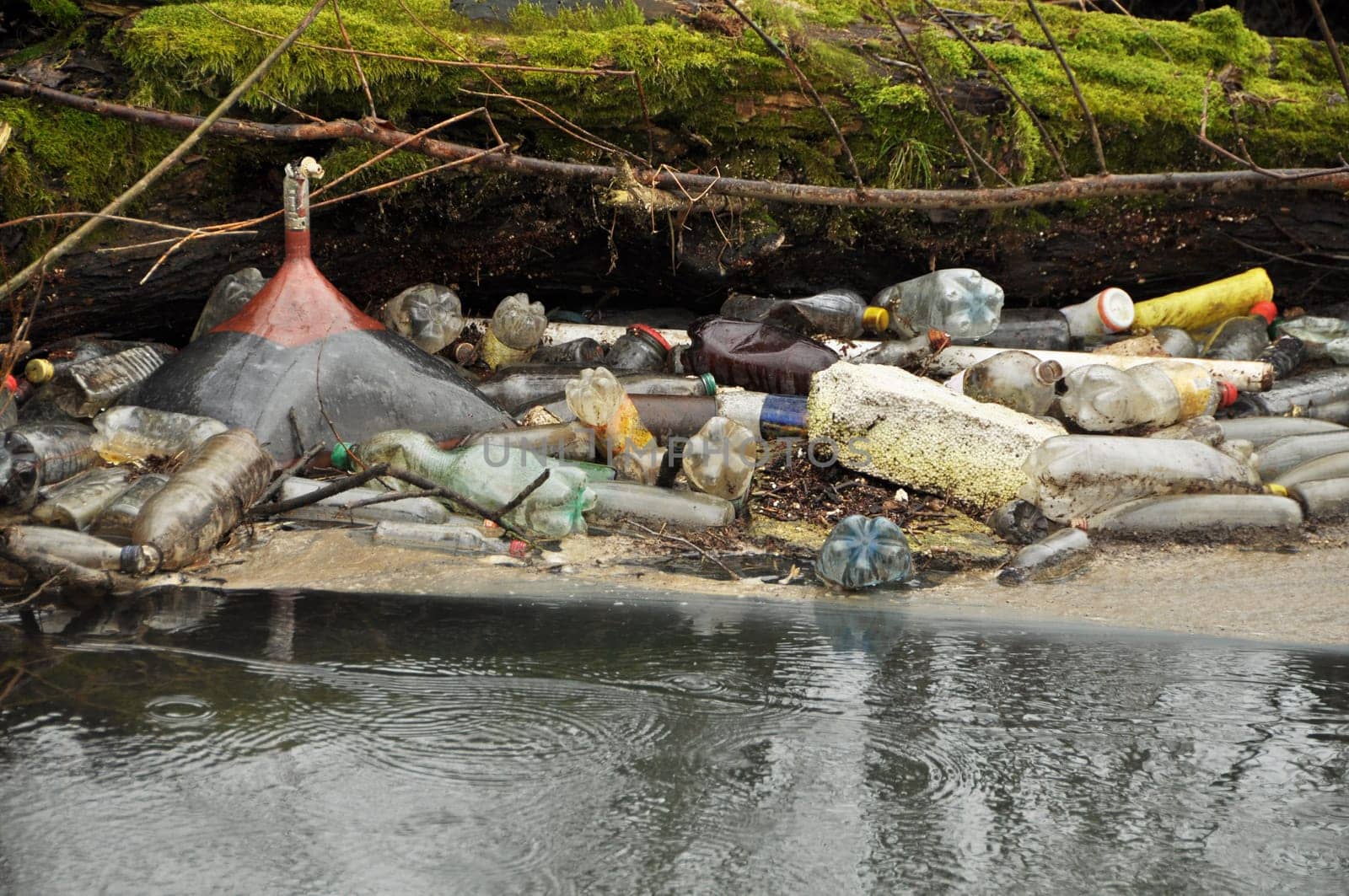 bottles and trash in the wild river