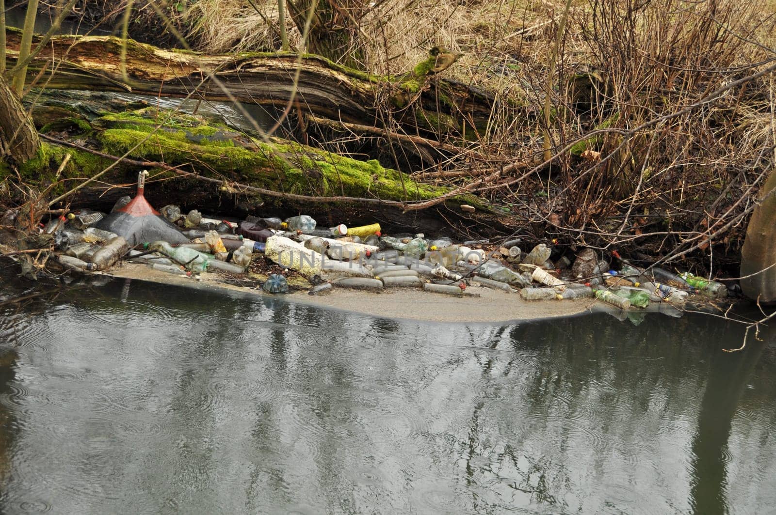 bottles and trash in the wild river