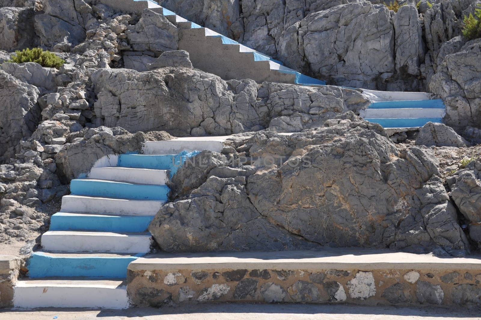 traditional white and blue stairs in a Greek island