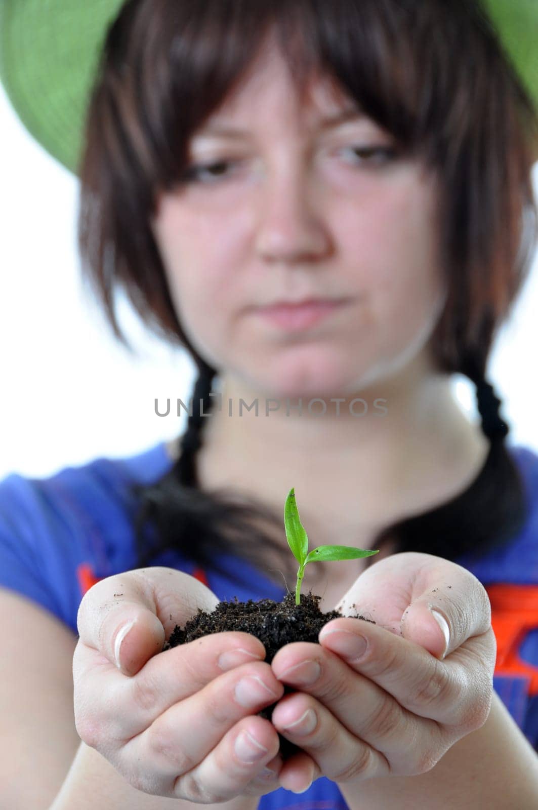 Gardener with plant in hands isolated on white background
