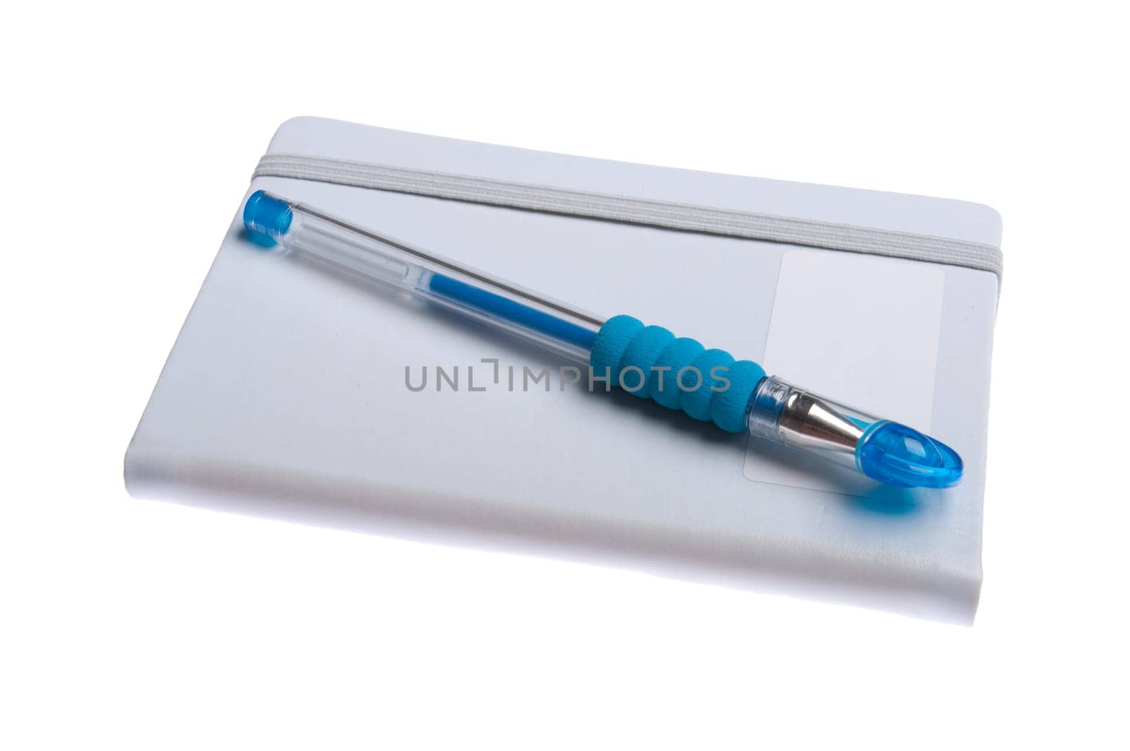 grey notebook diary or agenda and blue pen lying on the top (isolated on white background)