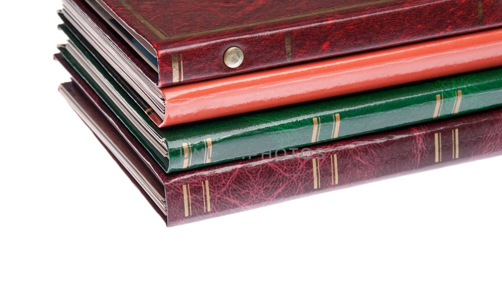 pile of antique photo albums isolated on white background