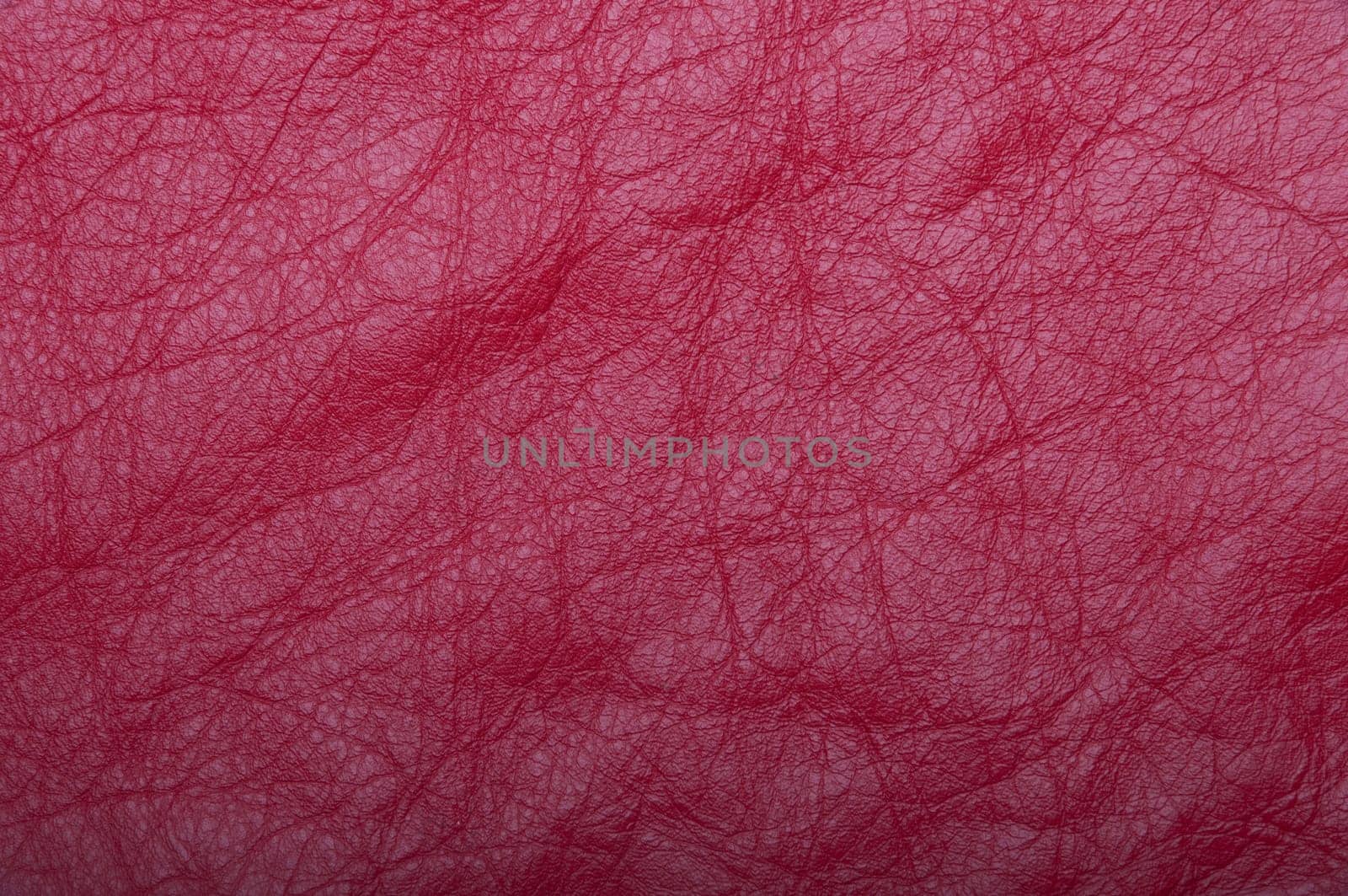 gorgeous red leather scrap background or texture