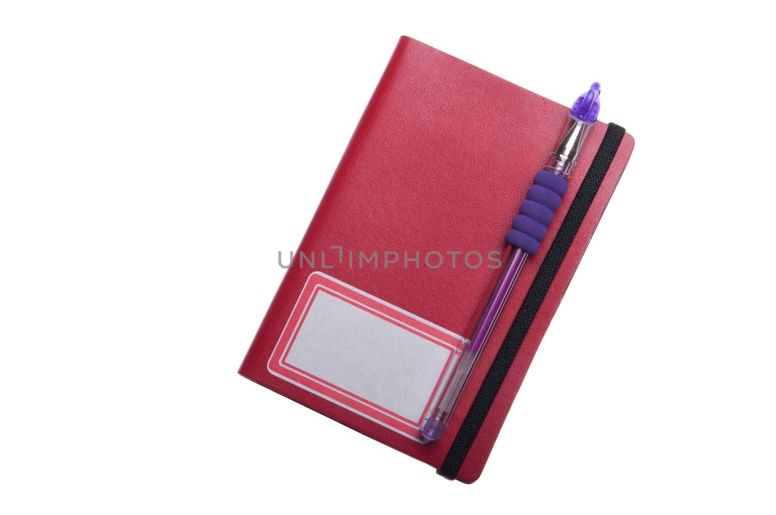 red notebook diary or agenda and purple pen lying on the top (isolated on white background)