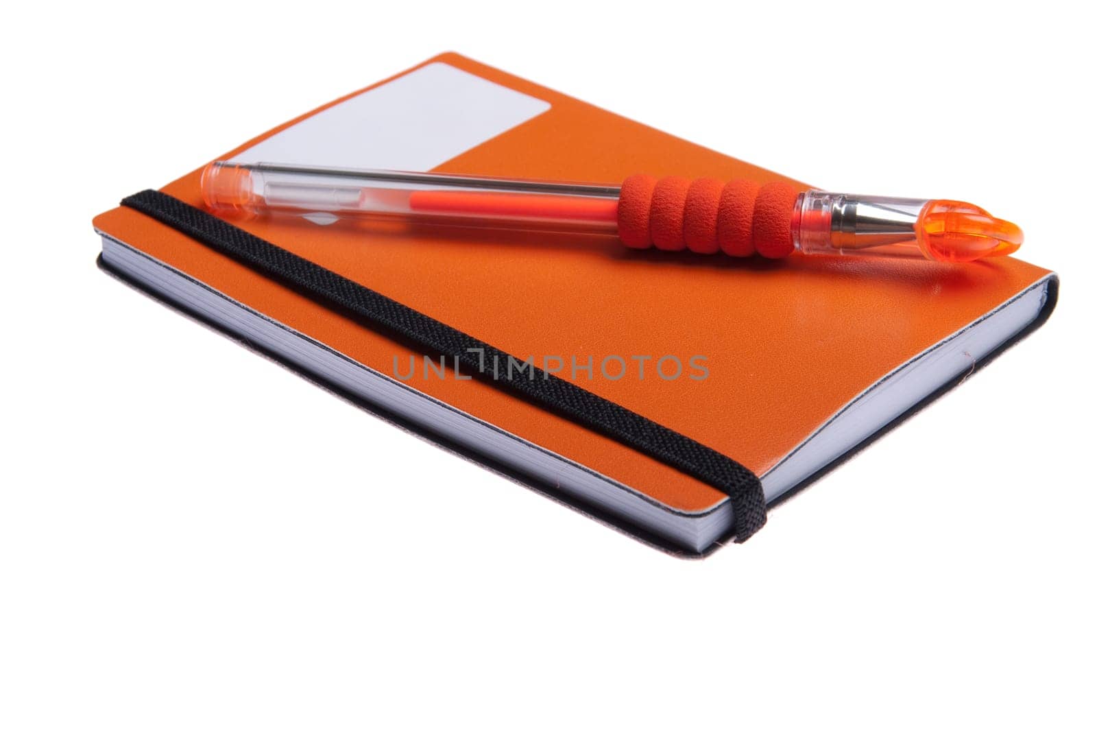 orange notebook diary or agenda and orange pen lying on the top (isolated on white background)