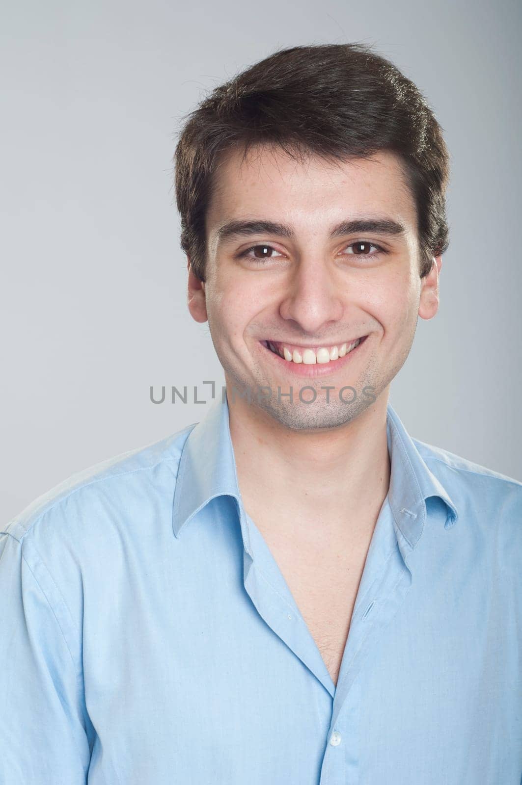 portrait of a smiling handsome trainee starting business career