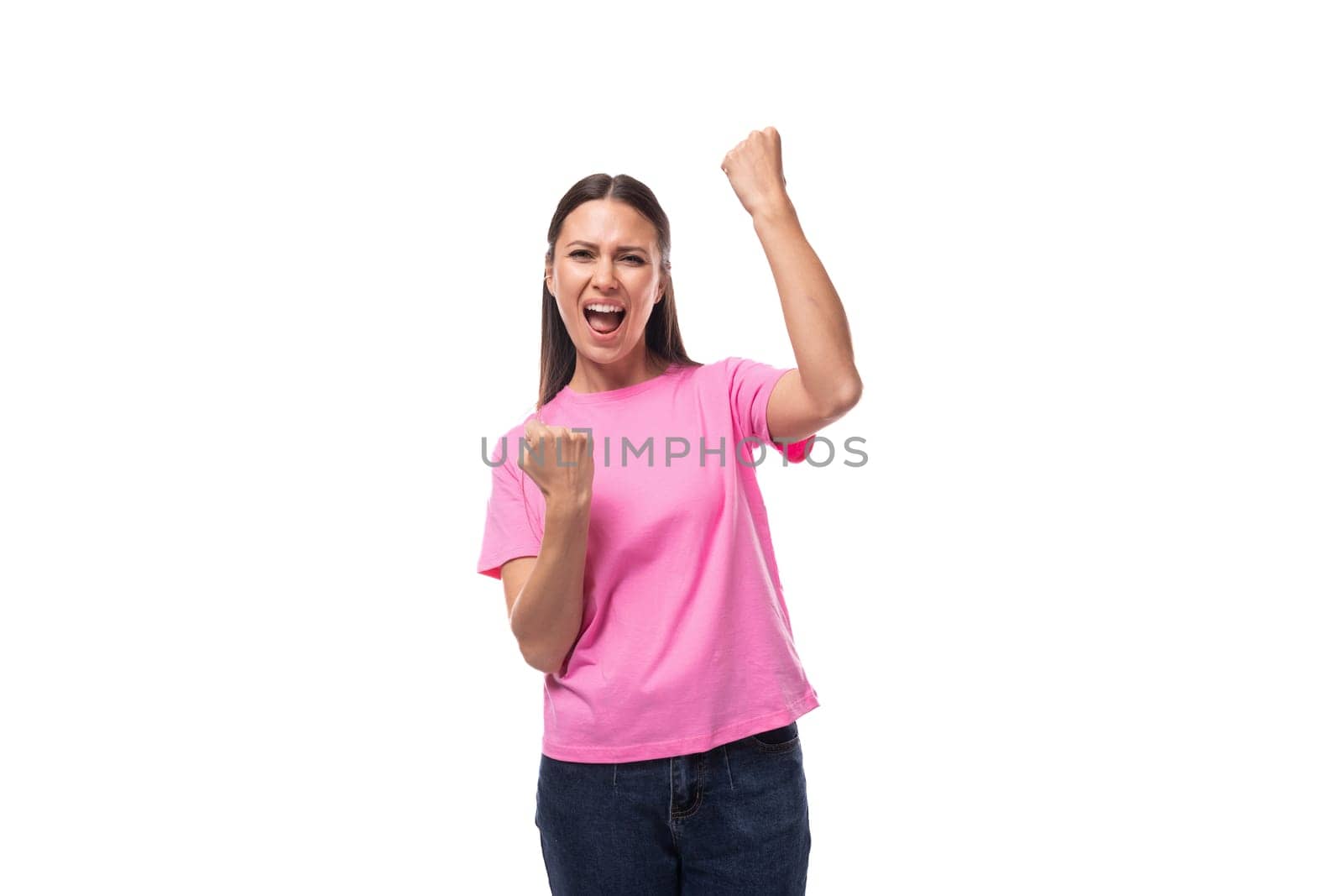 young charismatic good-looking woman with black hair wearing a pink t-shirt is experiencing joy and pleasure.