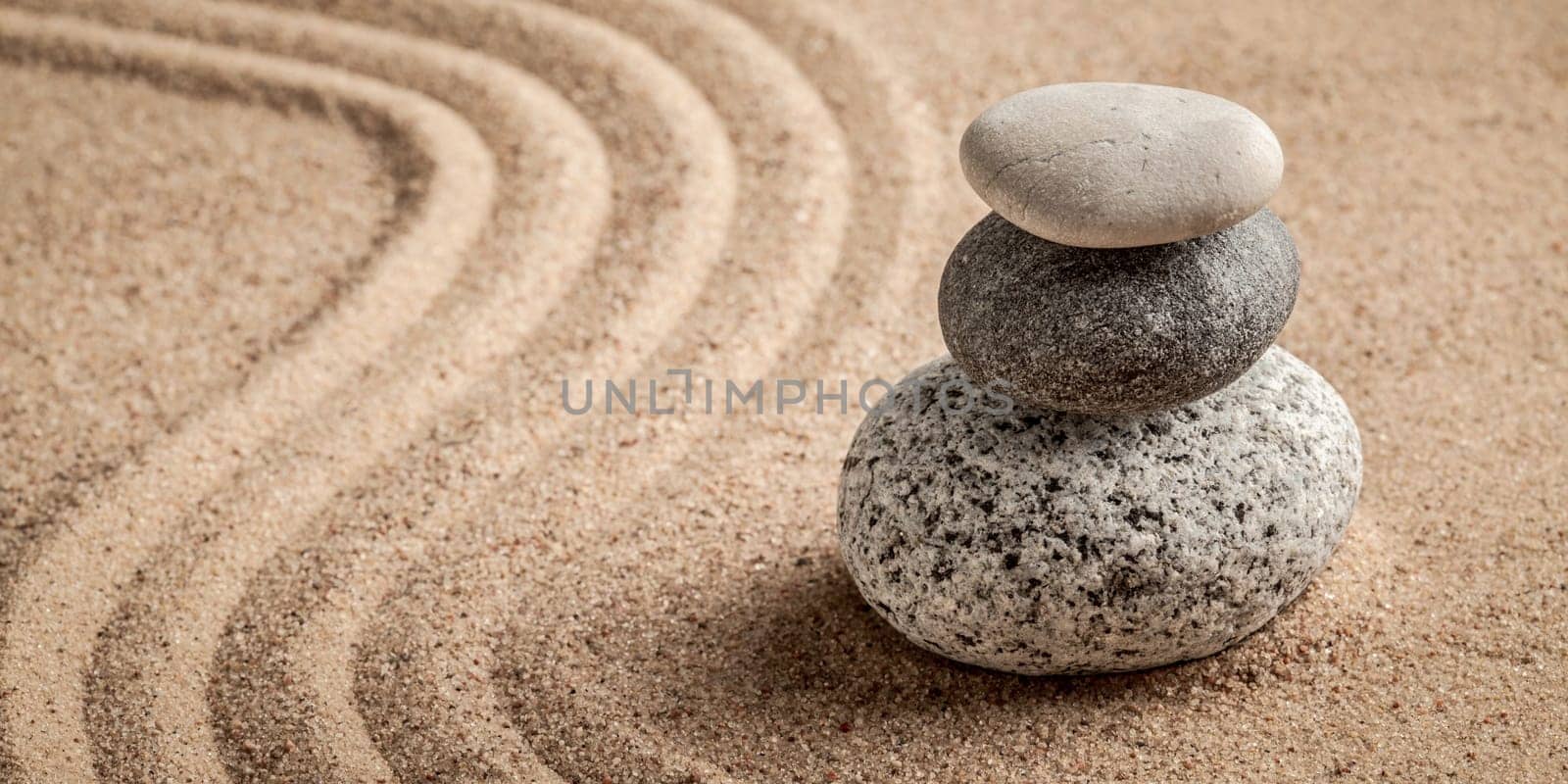 Japanese Zen stone garden - relaxation, meditation, simplicity and balance concept - letterbox panorama of pebbles and raked sand tranquil calm scene