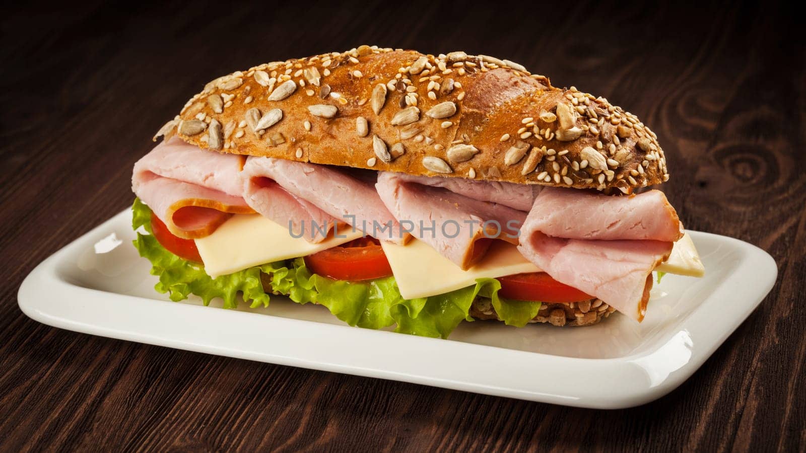 Ham sandwich on wooden background by dimol
