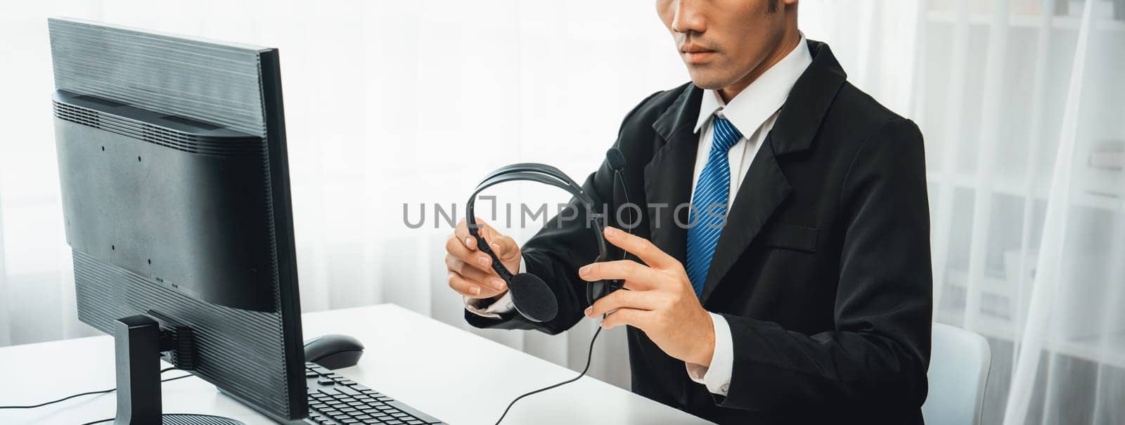 Business people wearing headset working in office to support remote customer or colleague. Call center, telemarketing, customer support agent provide service on telephone video conference oratory call