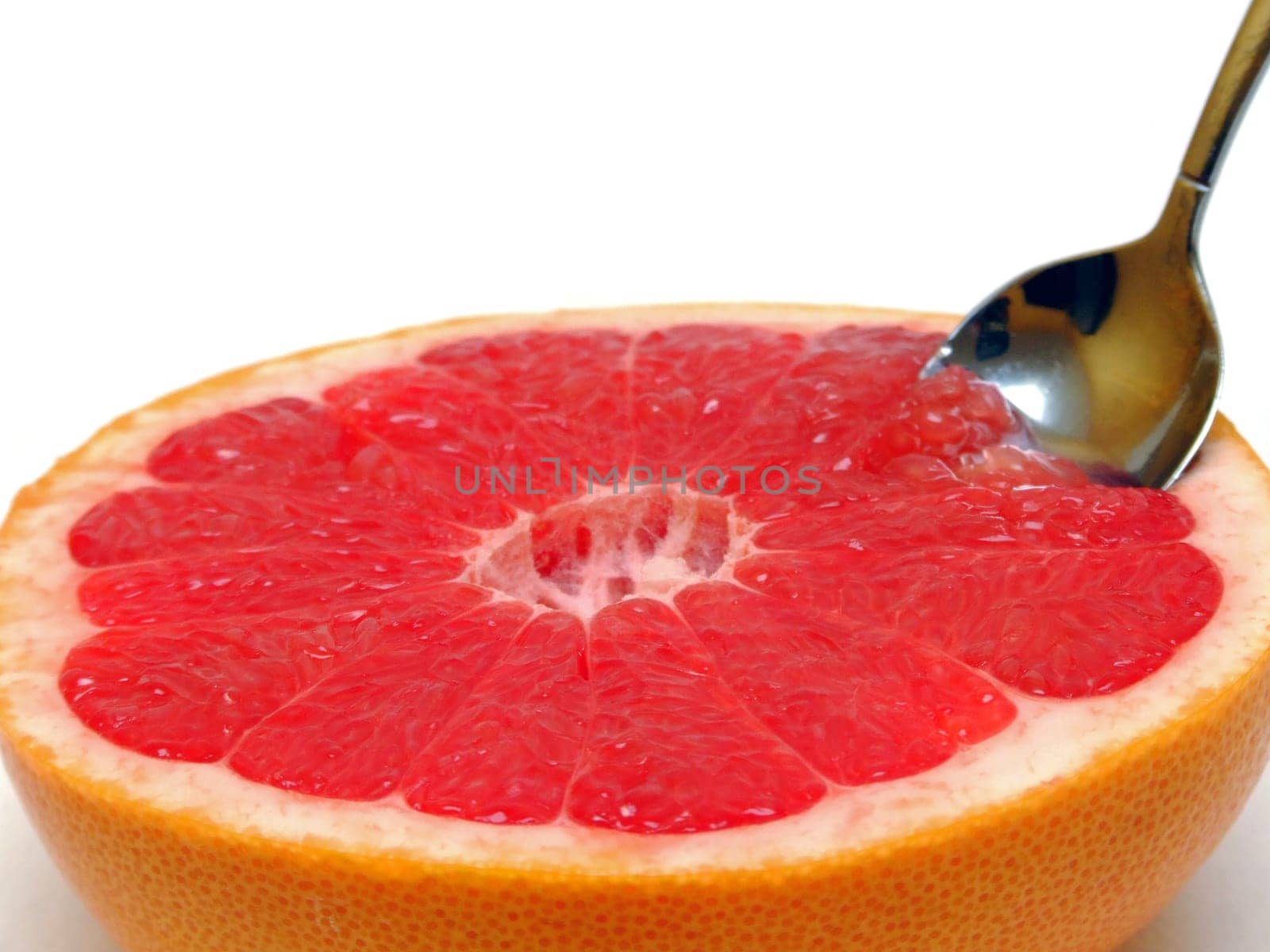 a grapefruit with spoon