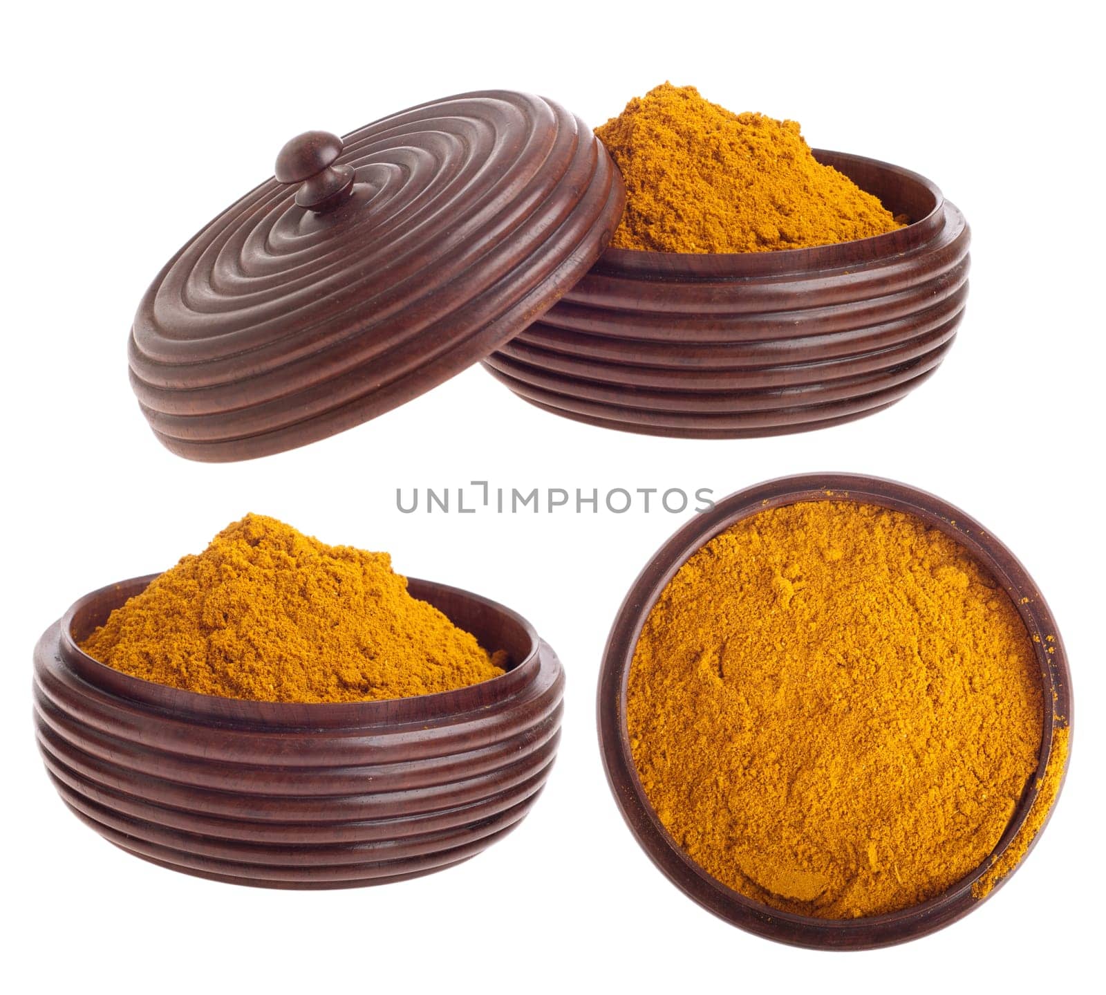 curry powder, mix of indian spices on a vintage wooden bowl (isolated on white background)
